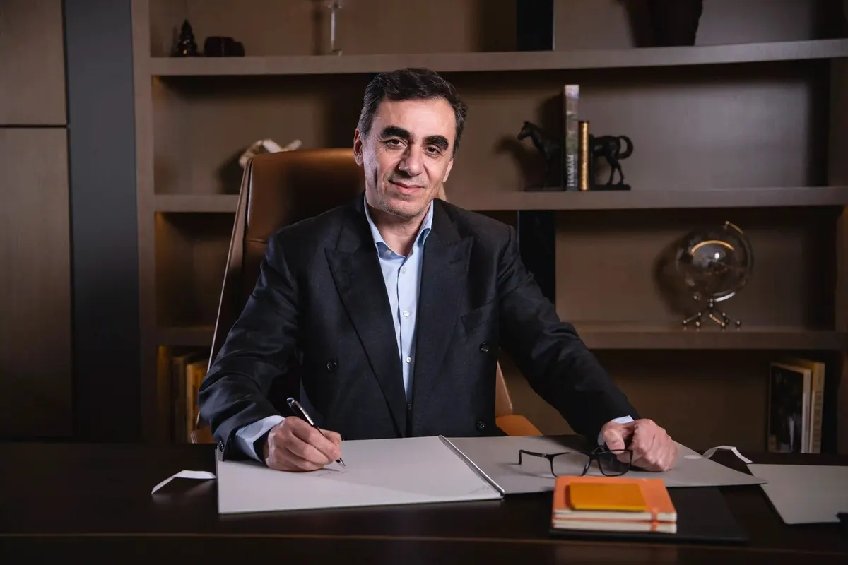 Dr Mehdi Kavoosi, Founder and Chairman of BAMX Developments, seated at his desk